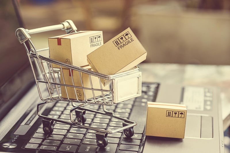 shopping-cart-with-boxes-on-laptop-computer.jpg